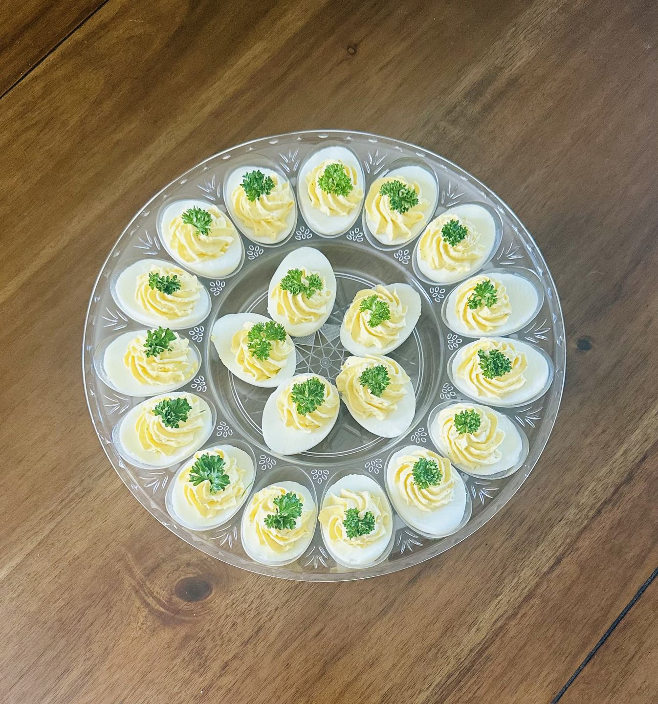Deviled eggs platter garnished with herbs