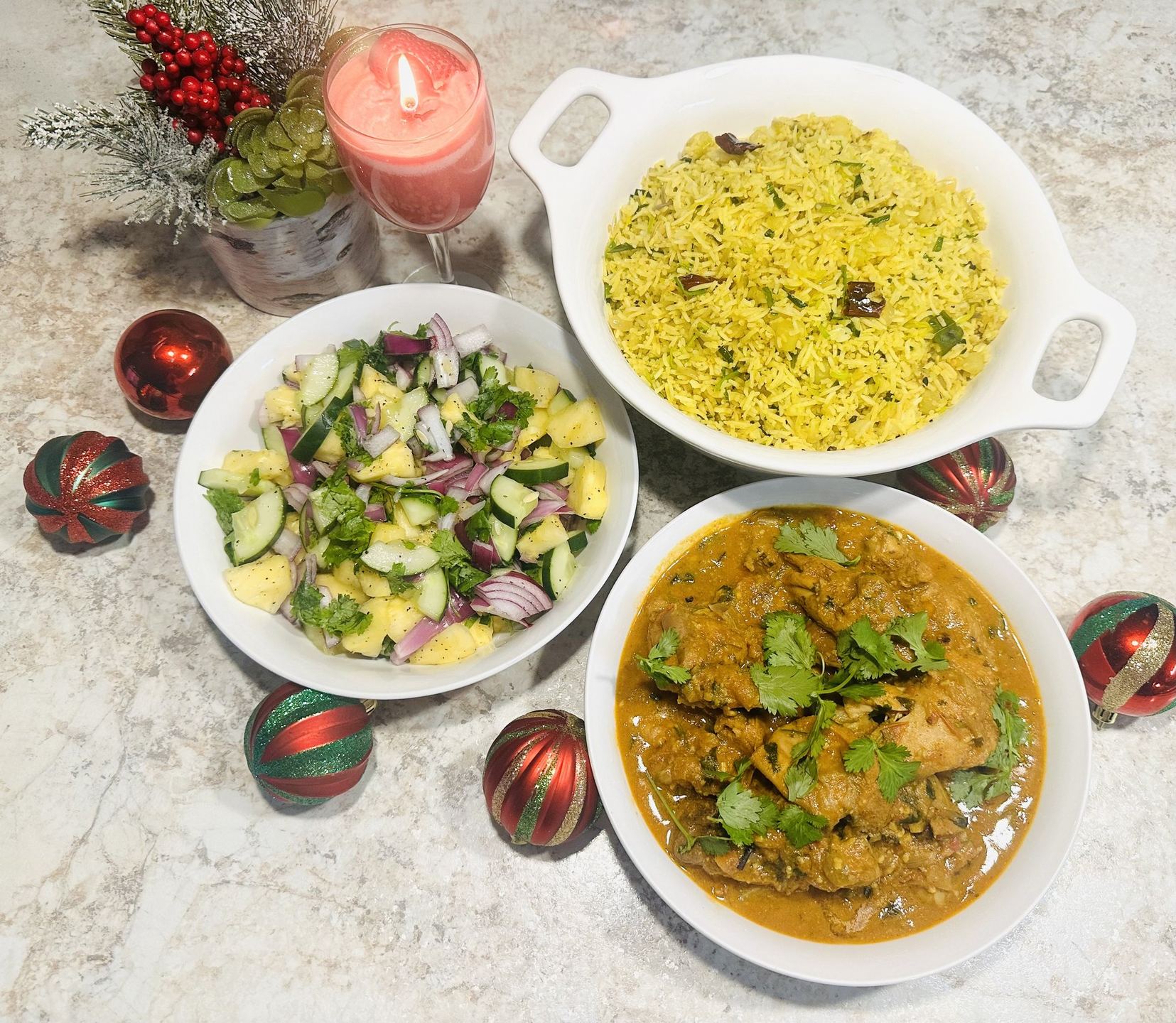 Plated rice and curry with vibrant accompaniments